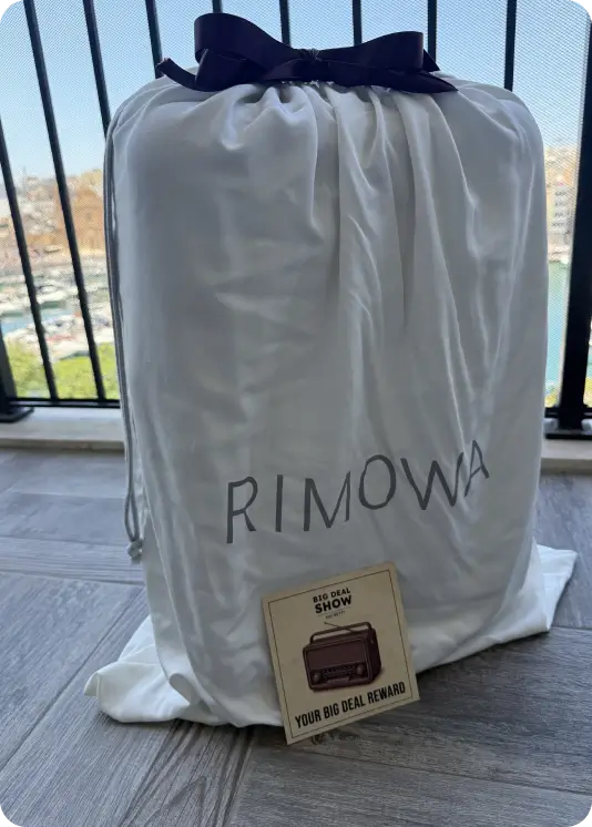 Big Deal Show reward — branded garment bag